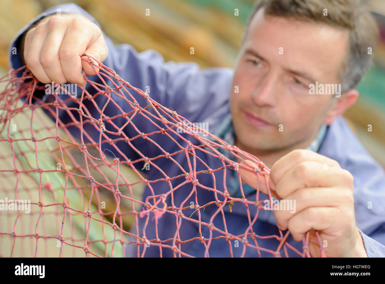 fixing the net Stock Photo Alamy