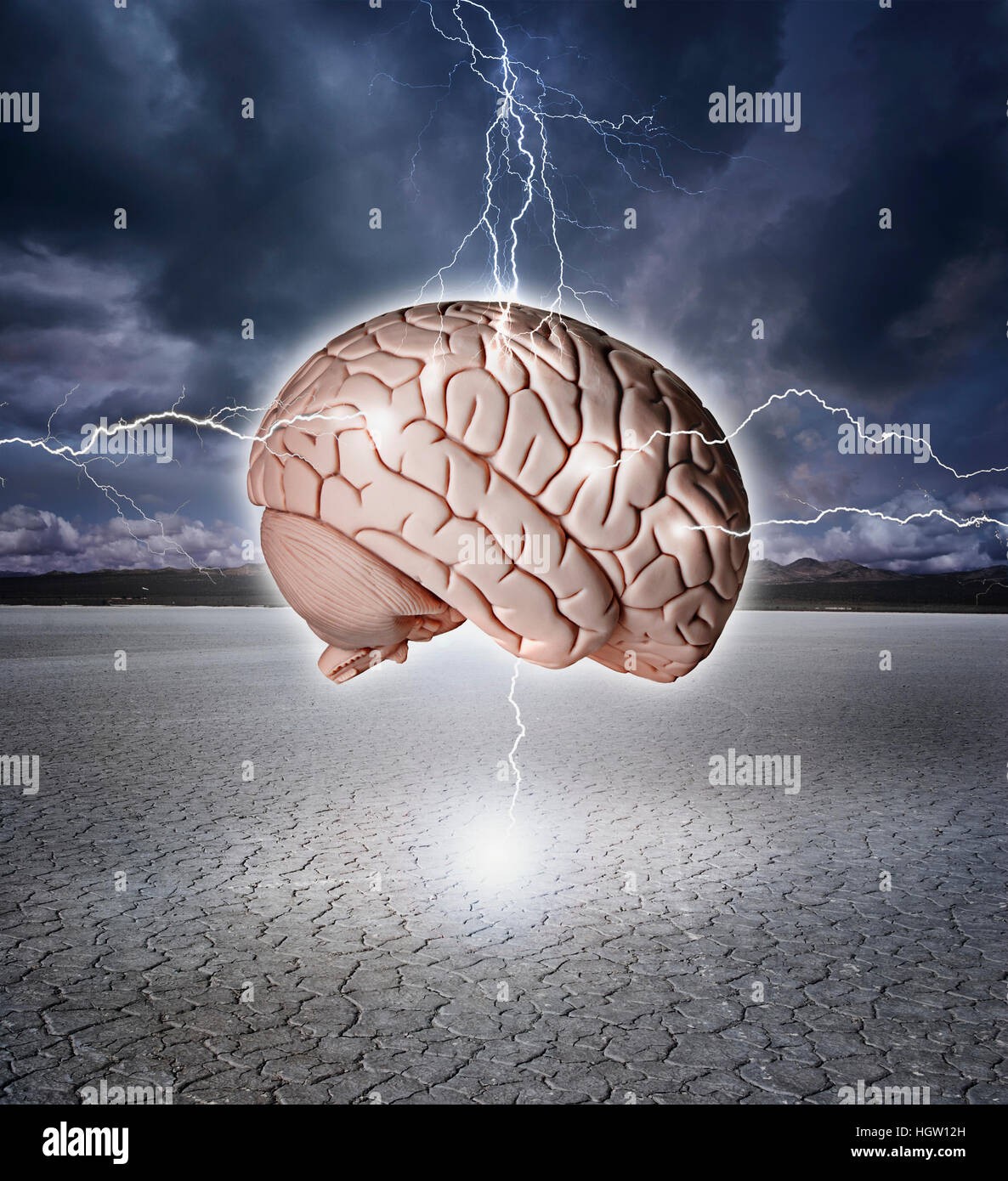 Digital Composite Of A Brain Model Being Shocked With Lightning Over A Dry Lake Bed. Stock Photo