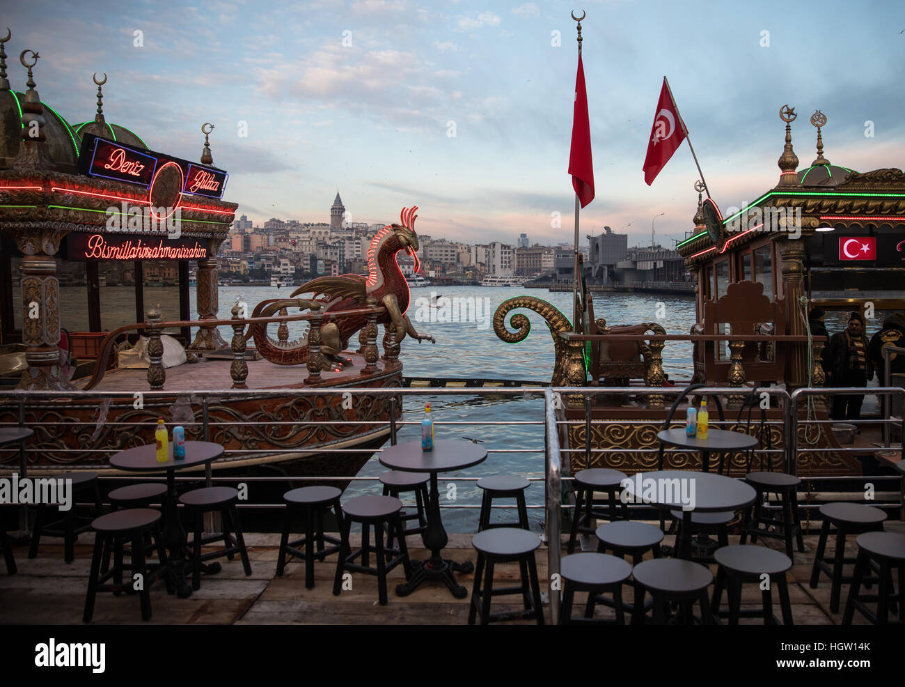 Gaudy Balik Ekmek ('Fish in Bread') boats await customers at Eminonu, Istanbul. Stock Photo