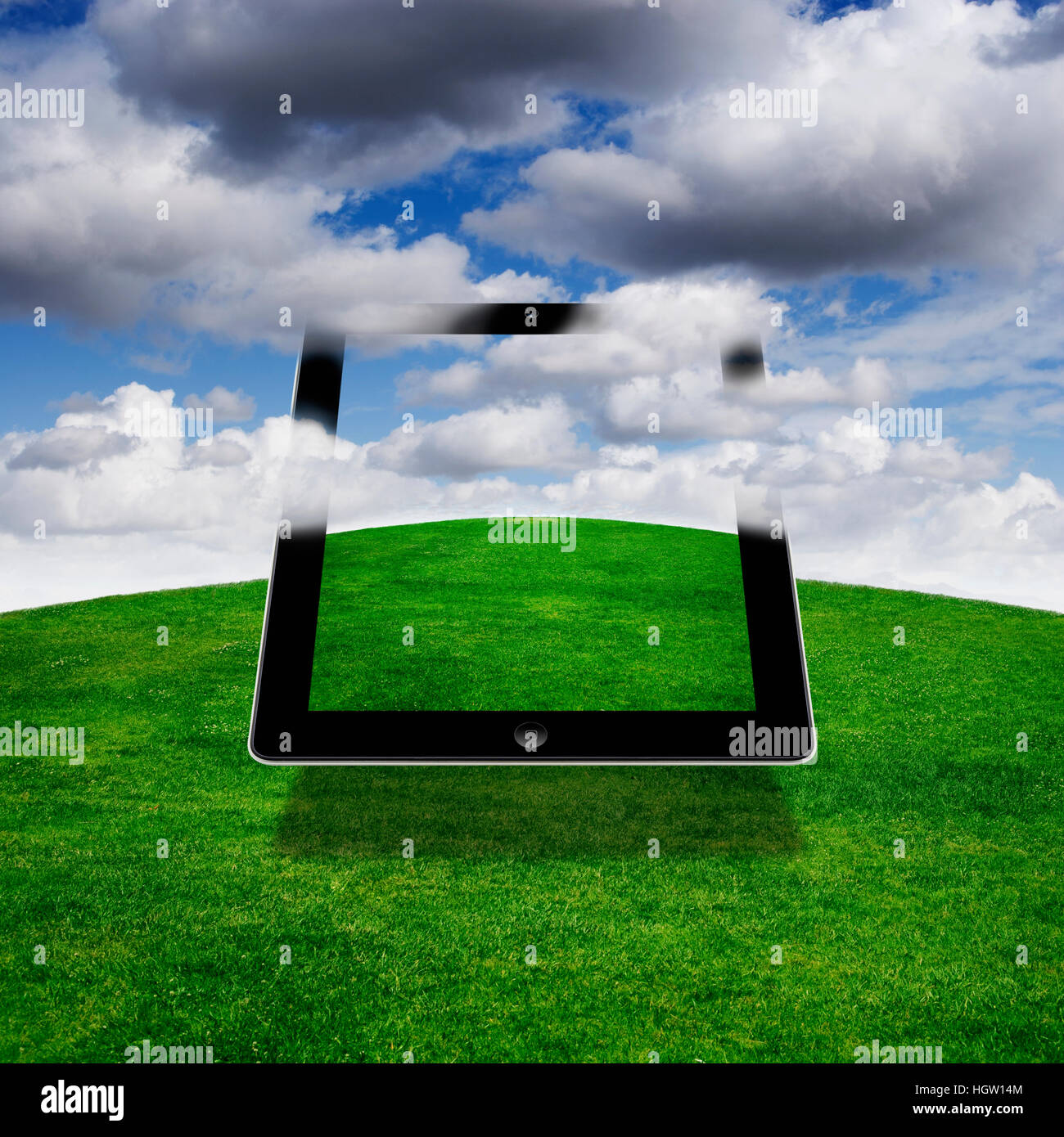 Composite Of A Digital Tablet With Clouds Stock Photo