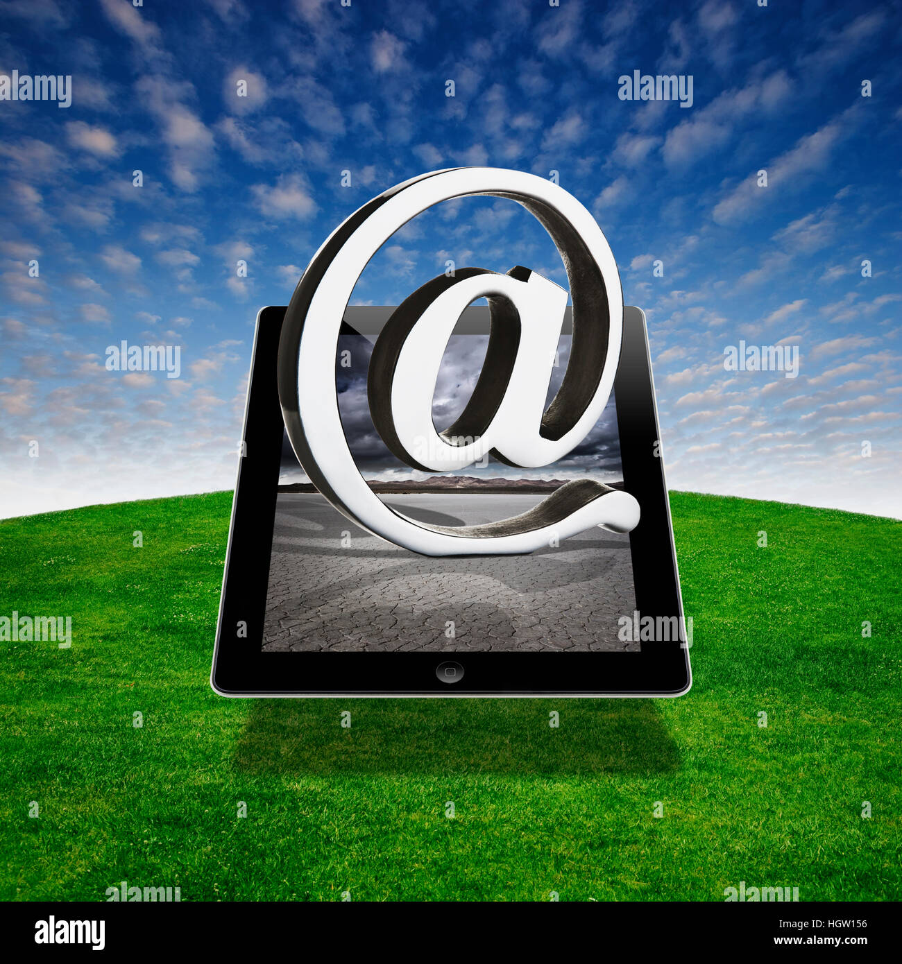 Digital Composite Of A Digital Tablet With An At Symbol Stock Photo