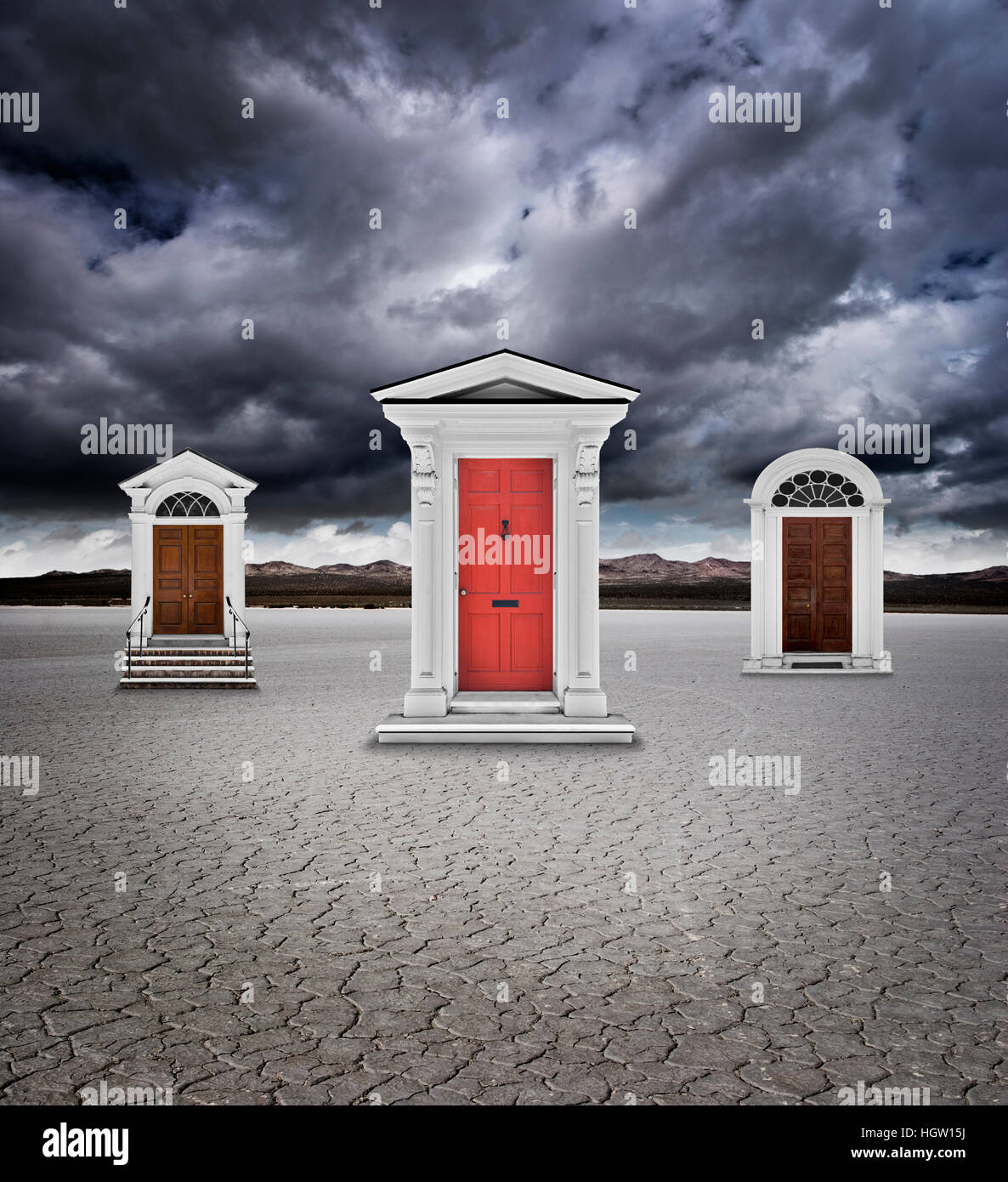 Three Doors In A Dry Lake Bed Under A Stormy Sky Stock Photo