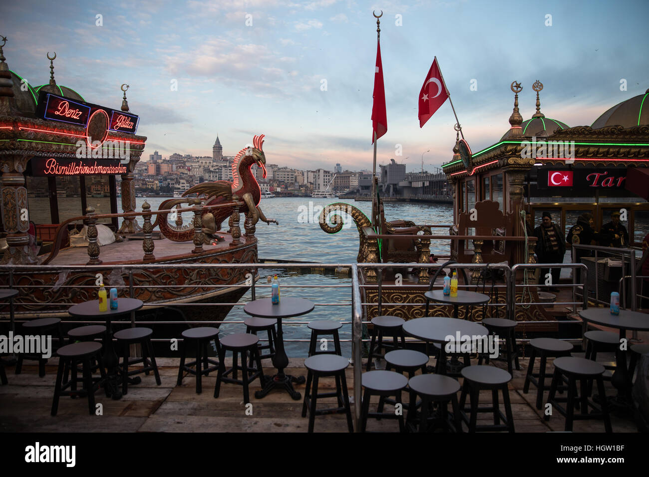 Gaudy Balik Ekmek ('Fish in Bread') boats await customers at Eminonu, Istanbul. Stock Photo