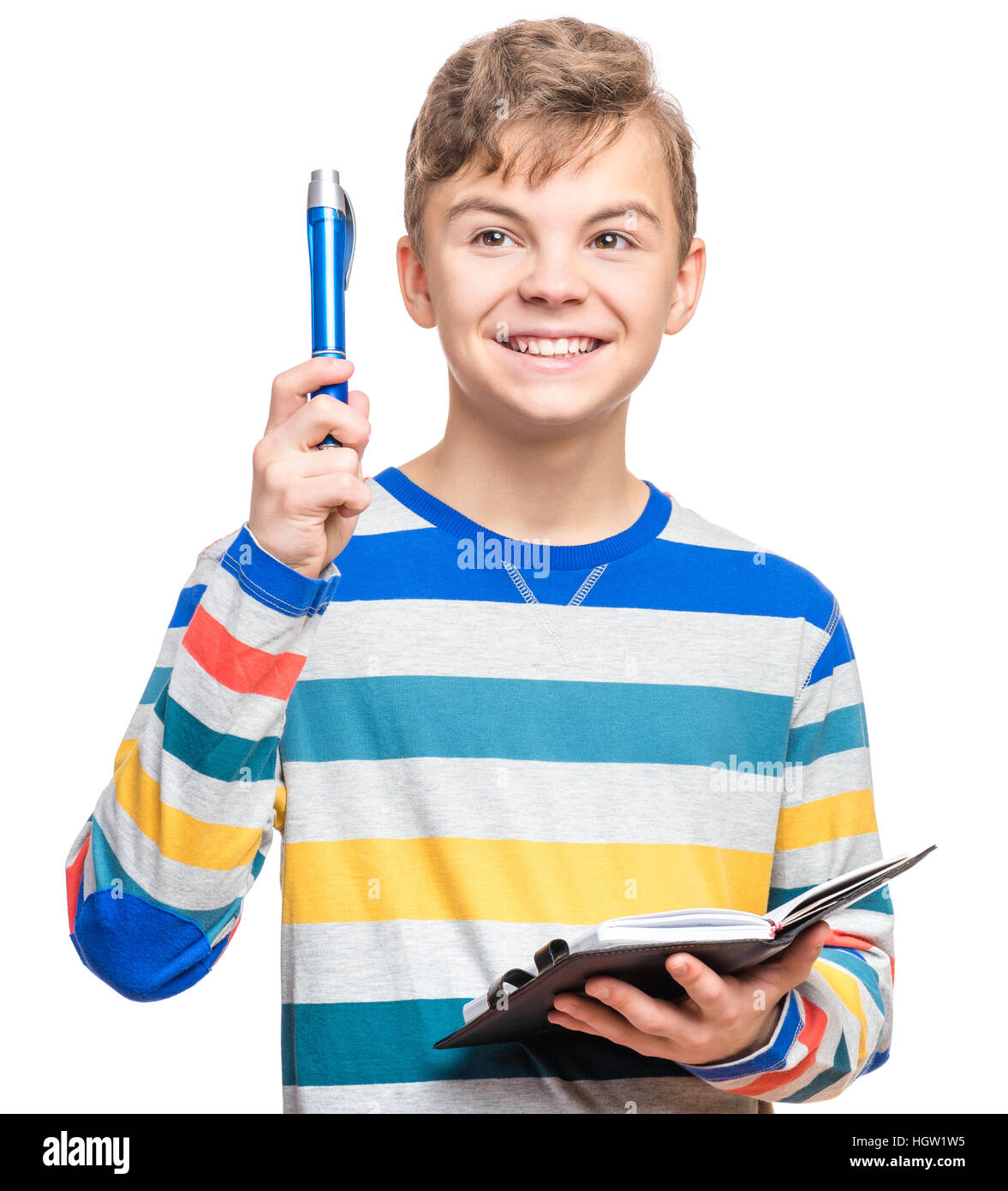 Teen boy with pen writing something Stock Photo Alamy