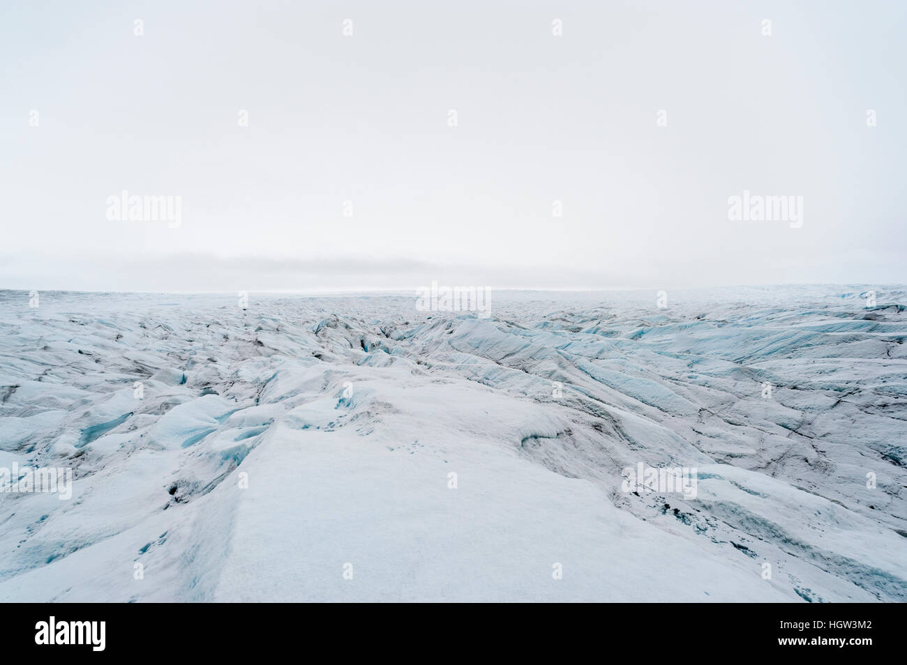 The frozen and barren wasteland of folded ice on the surface of the Greenland Ice Sheet. Stock Photo