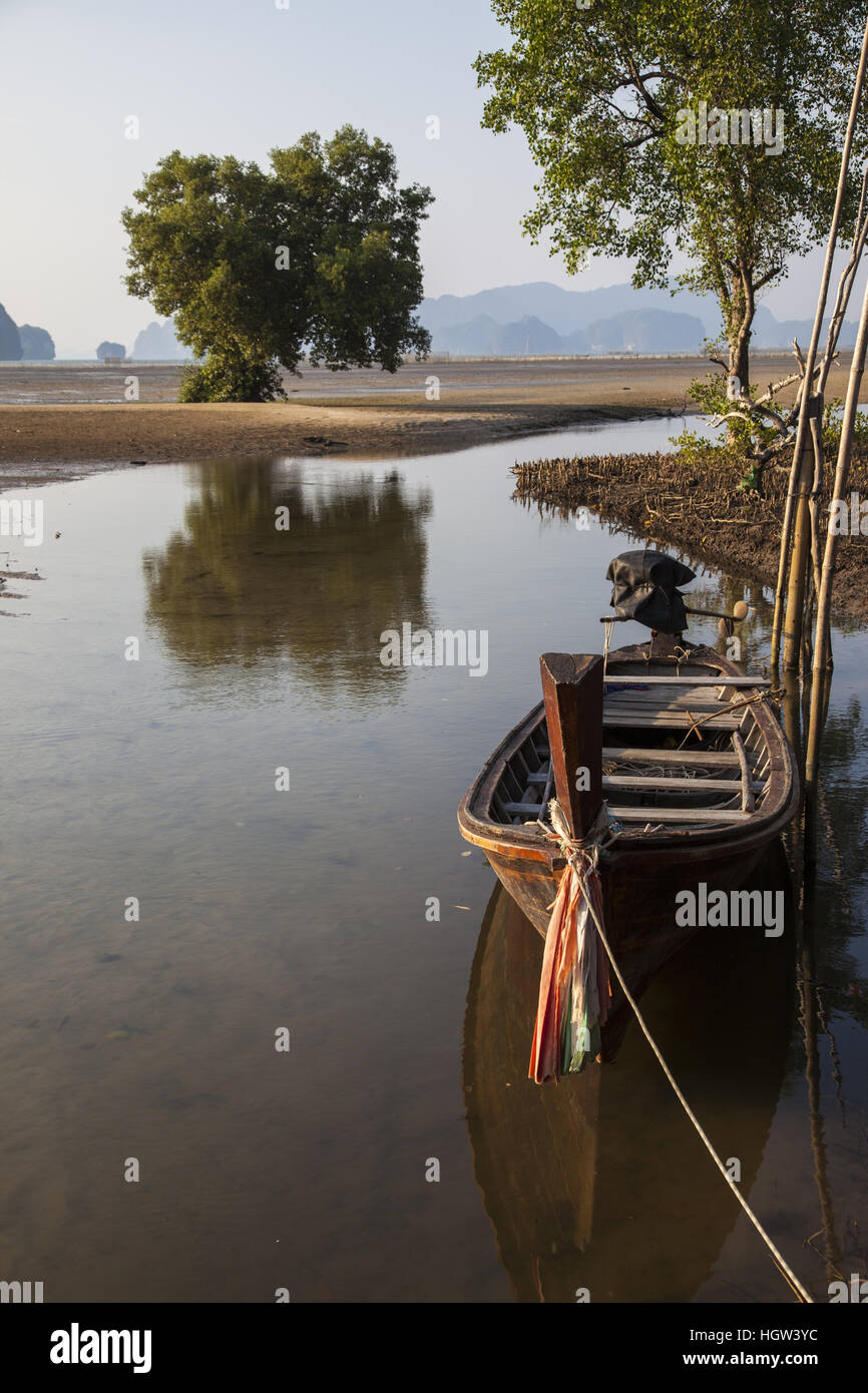 Boat on mangrove beach next to Bananas Bungalows Krabi, Thailand Stock Photo