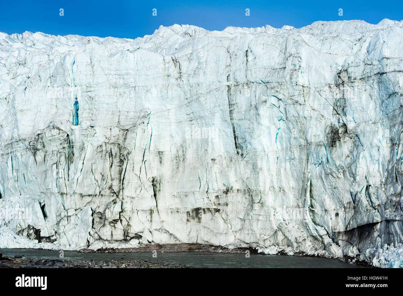 The sheer ice cliff of a glacier fracture zone. Stock Photo