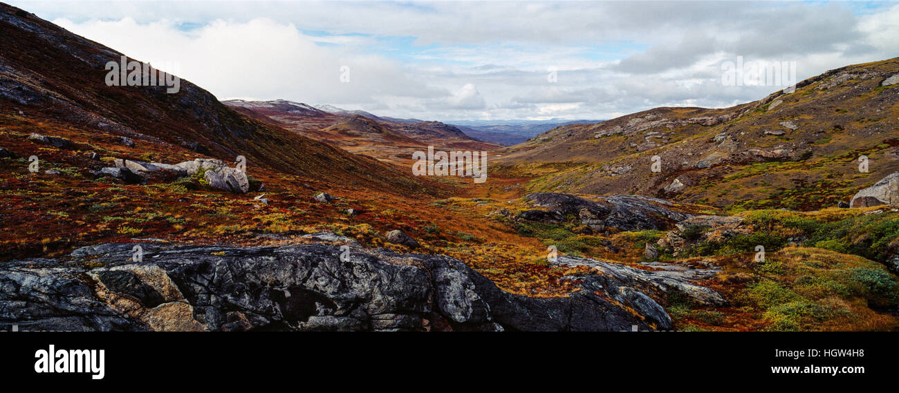 A tundra valley surrounded by rolling hills in Autumn colours Stock ...