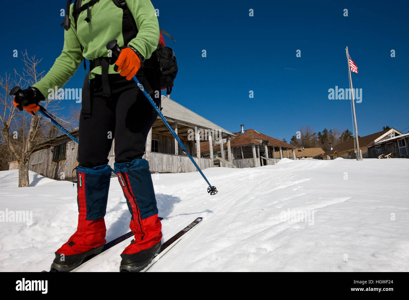 A woman crosscountry skiing at West Branch Pond Camps near Greenville