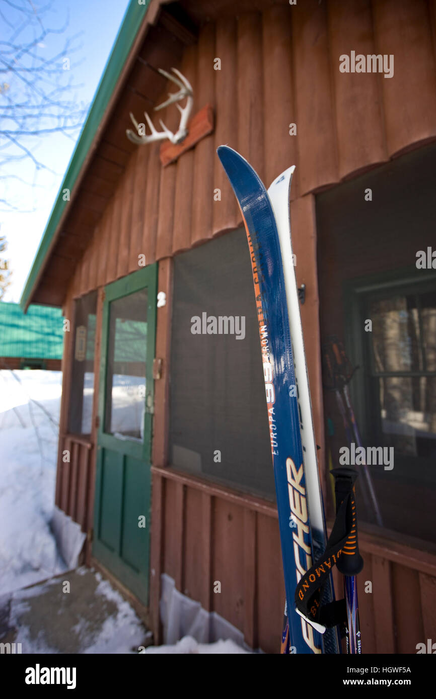 Skis In The Snow Outside A Cabin At Medawisla Wilderness Camps