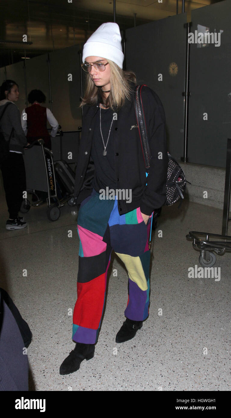 Cara Delevingne arrives at Los Angeles International Airport Featuring