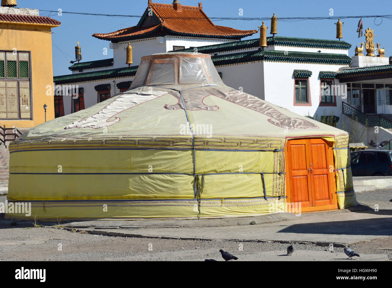 Traditional Gert among local houses in Mongolia with bright orange door Stock Photo Alamy