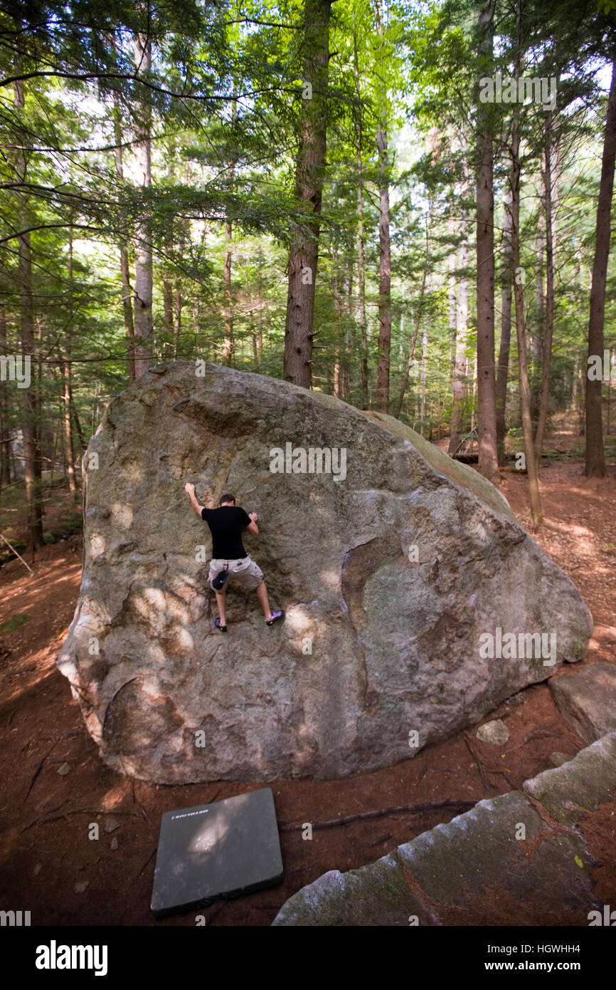 A man bouldering in "The Boulders" section of New Hampshire's