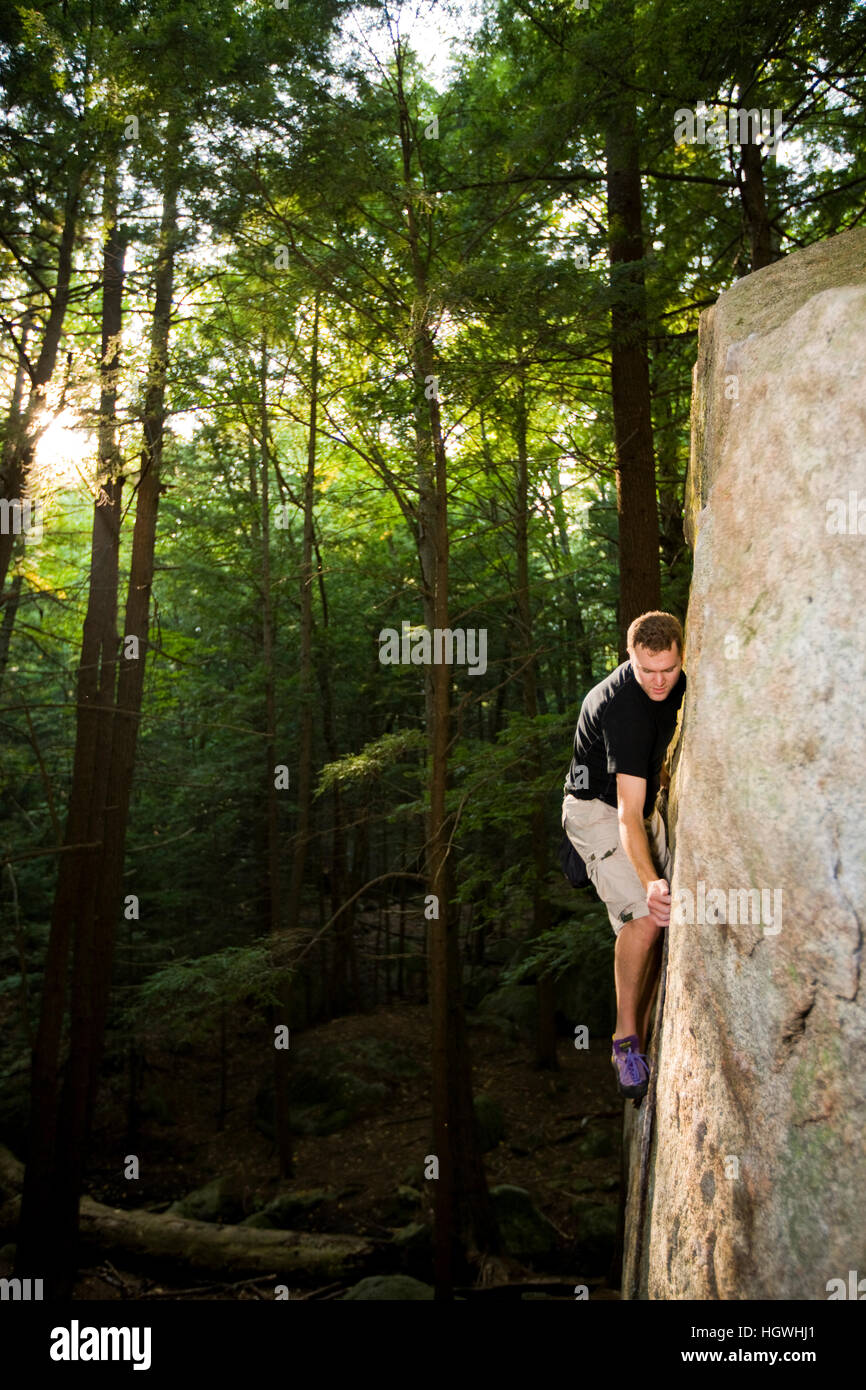 A man bouldering in "The Boulders" section of New Hampshire's