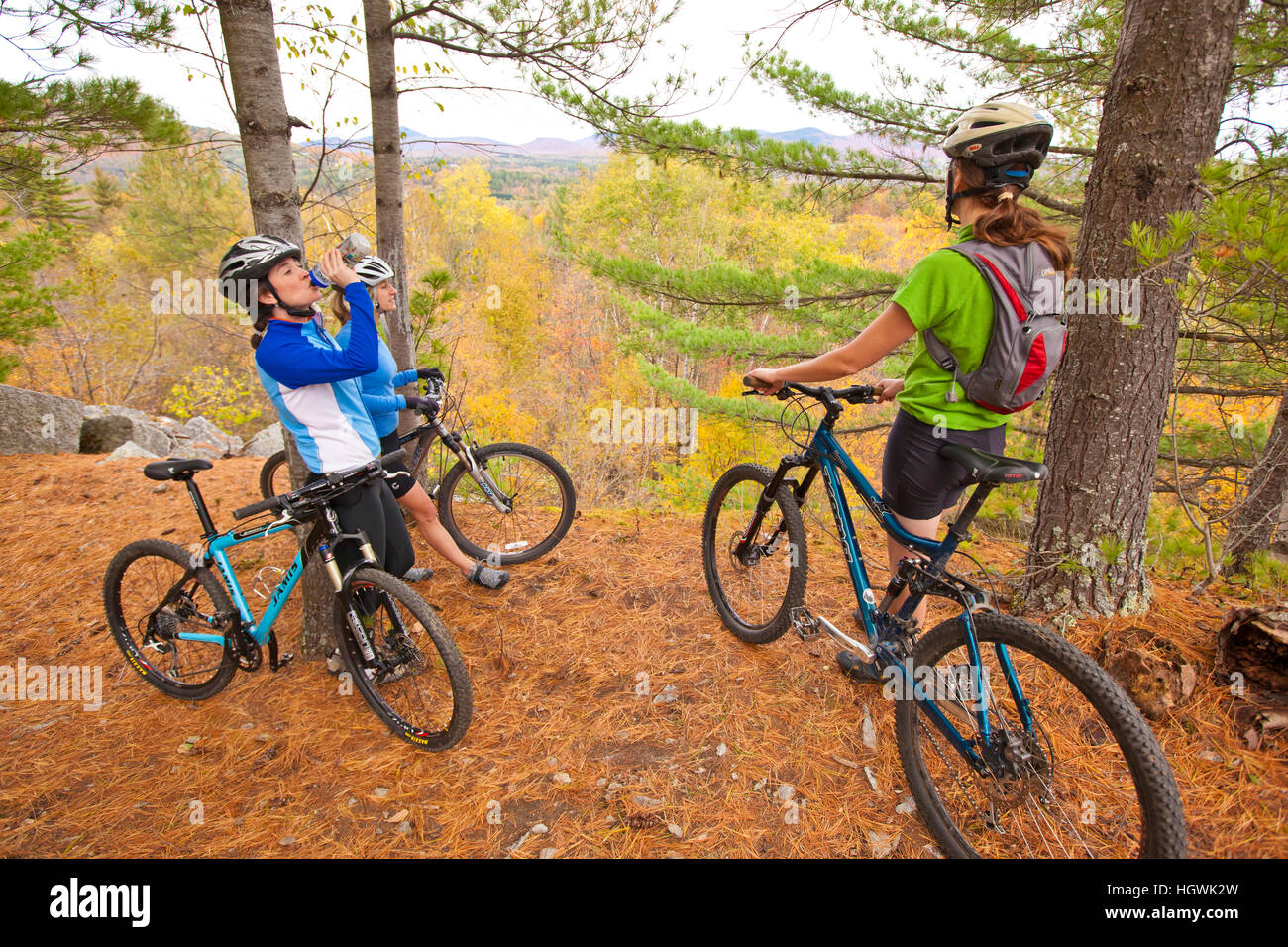 Women mountain biking on a trail on Millstone Hill in Barre, Vermont
