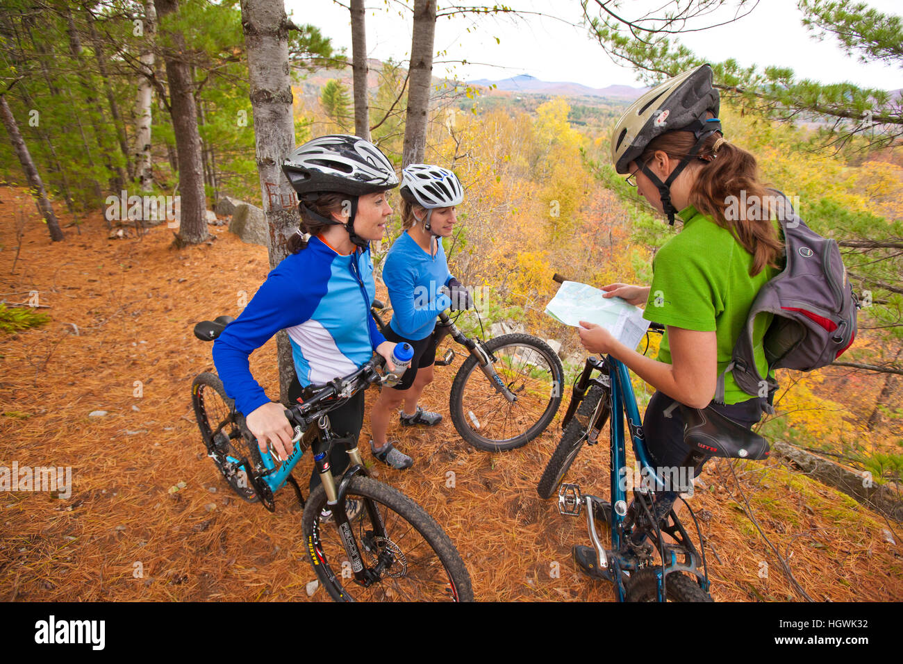 Women mountain biking on a trail on Millstone Hill in Barre, Vermont
