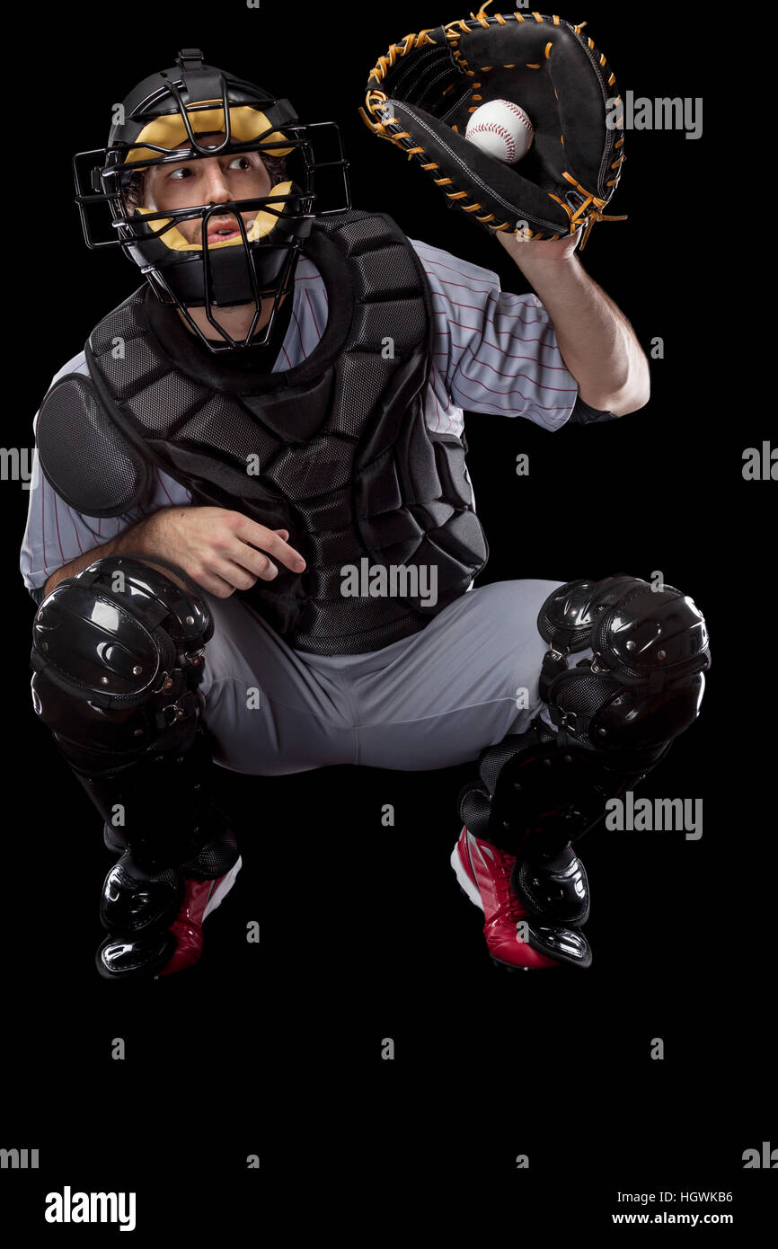 Baseball Player Catcher Catching A Wild Pitch On A Black Background Studio Shot Stock Photo Alamy