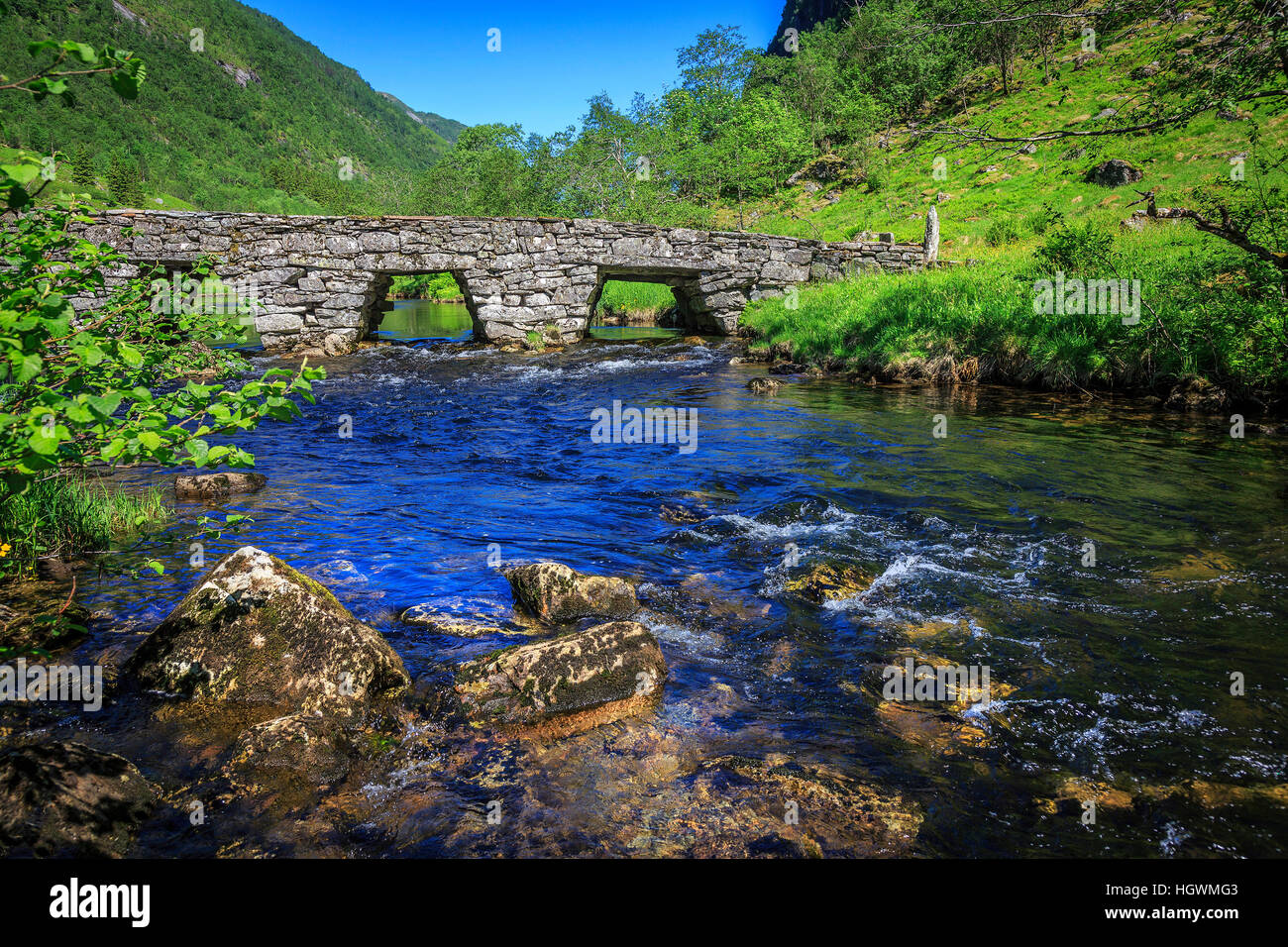 The old stone Honndola Bridge,  Sogn og Fjordane, Norway taken on a Spring morning. Stock Photo