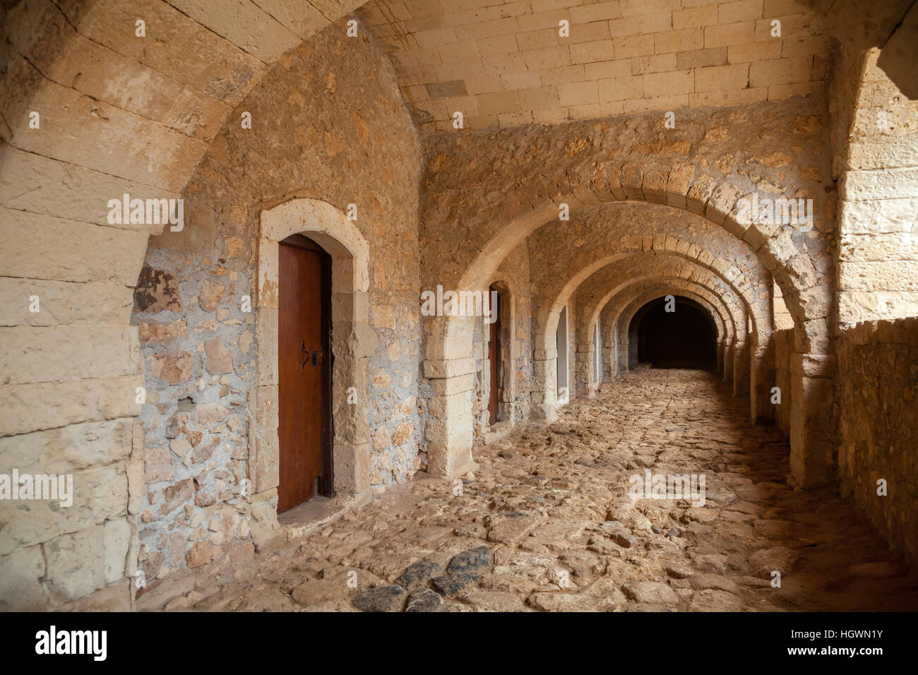 Stone corridor at greek orthodox Arkadi Monastery in Crete Greece Stock Photo