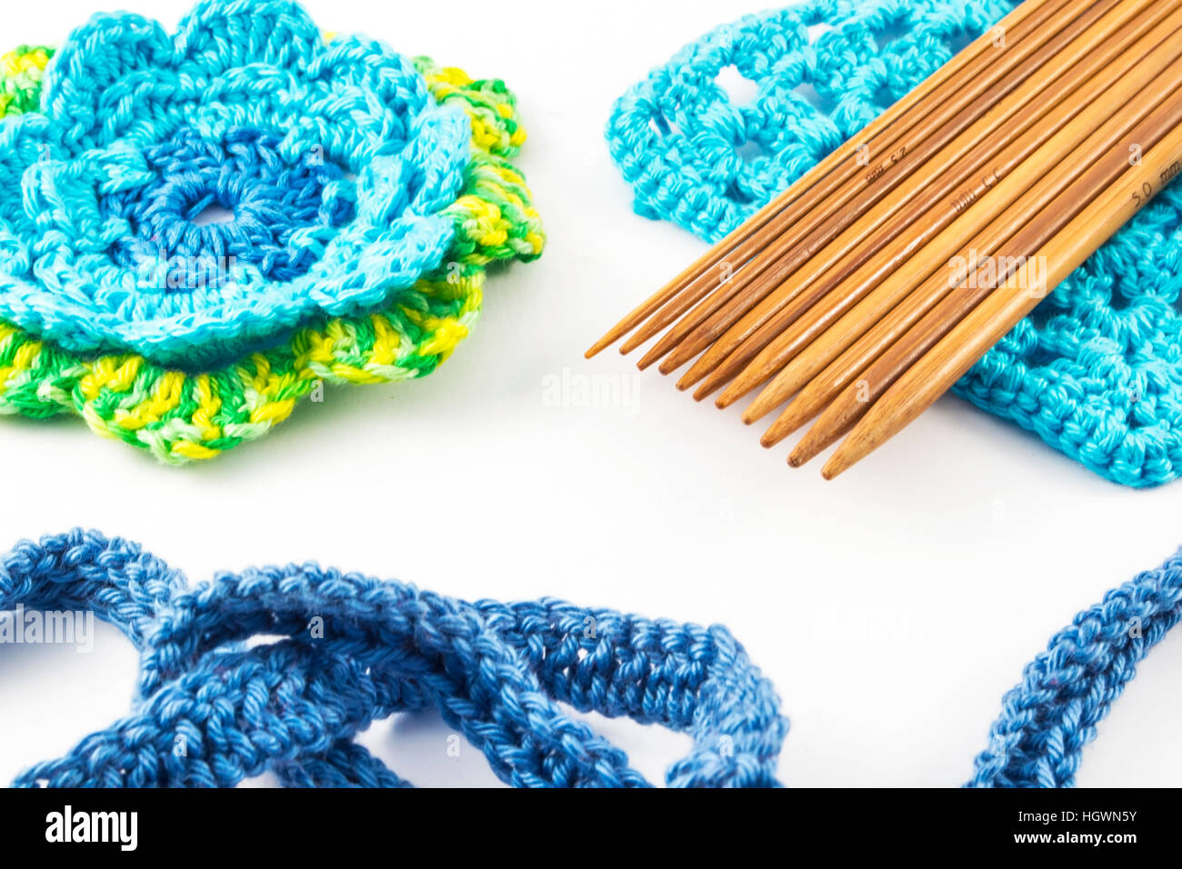 Crochet hooks and wool on white background Stock Photo