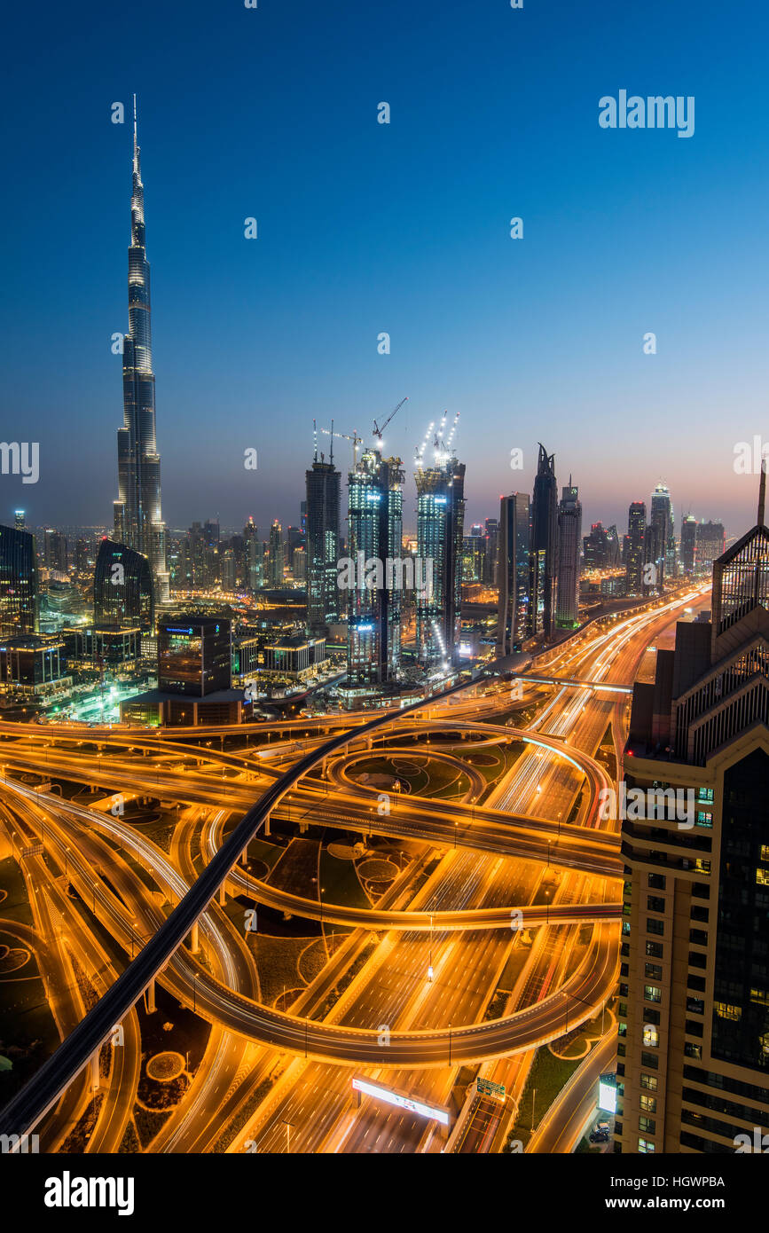 Night downtown skyline with Burj Khalifa skyscraper and Sheikh Zayed Road intersection, Dubai, United Arab Emirates Stock Photo