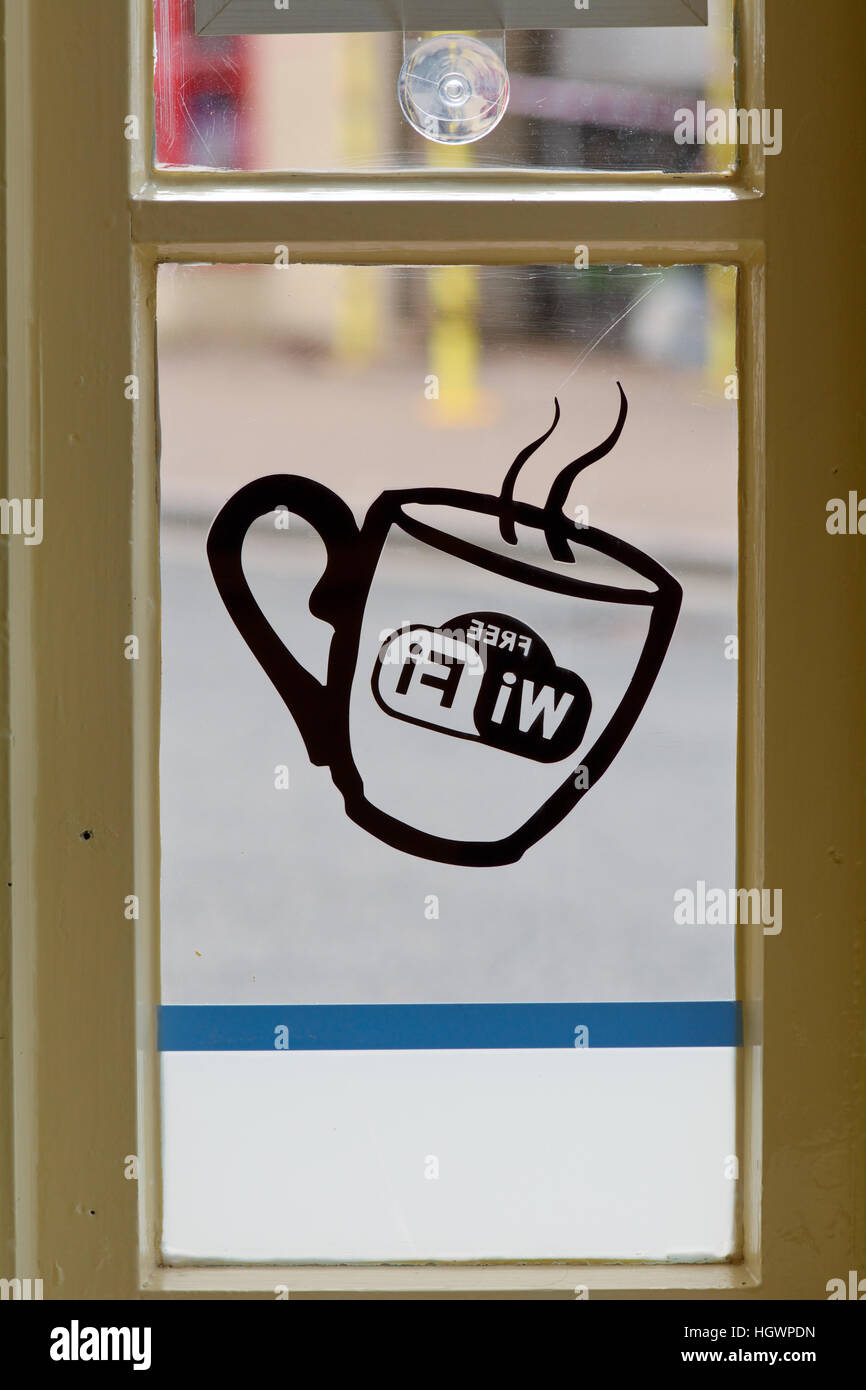 Free Wifi sign in window of cafe Stock Photo