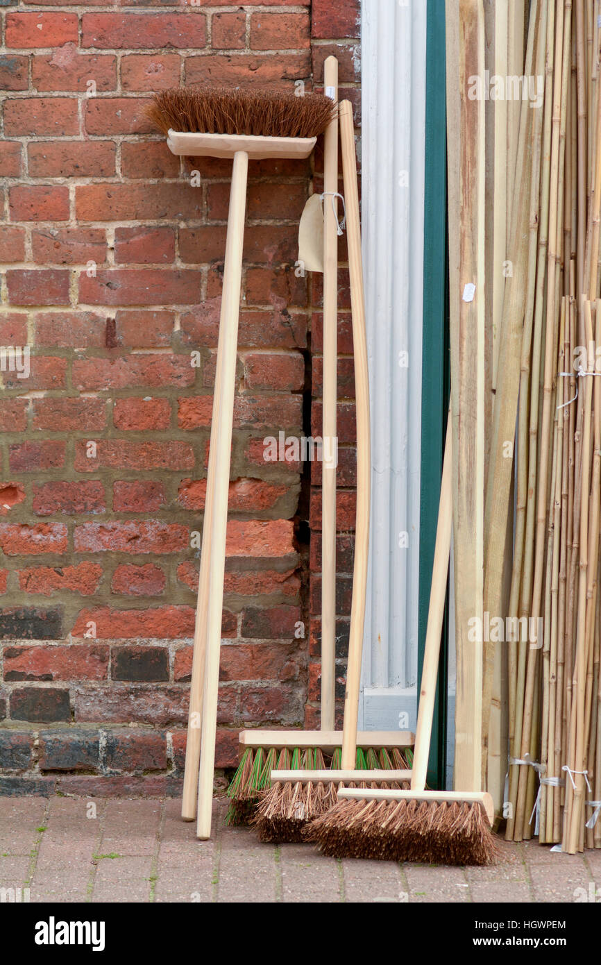 Brooms with long wooden handles for sale outside shop Stock Photo Alamy