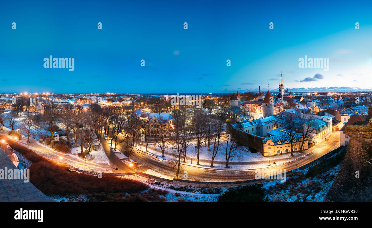 Tallinn, Estonia. Panorama Of Old Part Of Traditional Medieval Houses, Old Narrow Streets And Ancient Towers With Fortification Walls In Evening, Nigh Stock Photo