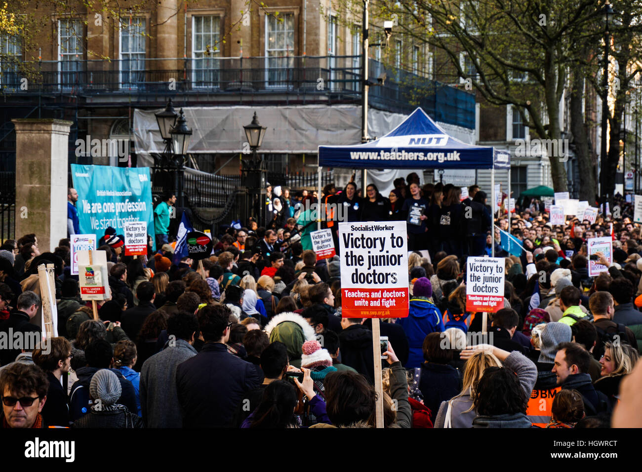 A junior doctor holds up a placard saying "Victory to the junior doctors" during a junior doctor protest in London against Jeremy Hunt's contract Stock Photo