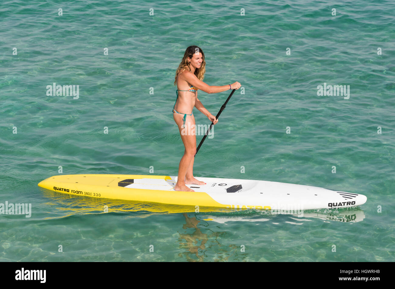 Woman on a Stand up paddle surf. Tarifa, Costa de la Luz, Cadiz, Andalusia, Spain. Stock Photo