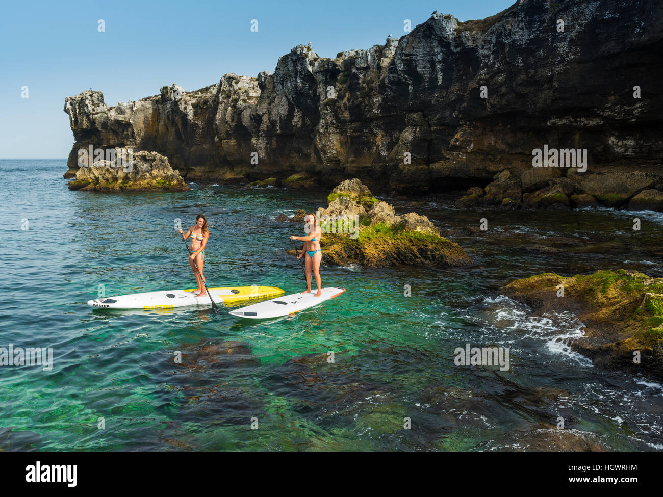Women enjoying stand up paddle surf. Tarifa, Costa de la Luz, Cadiz
