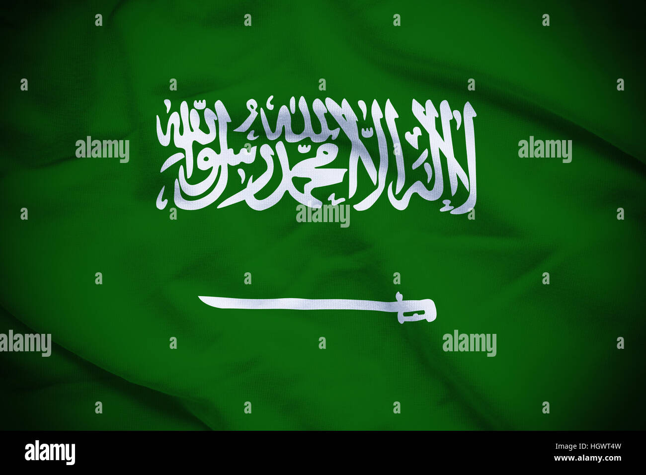 Wavy and rippled national flag of Saudi Arabia background. Stock Photo