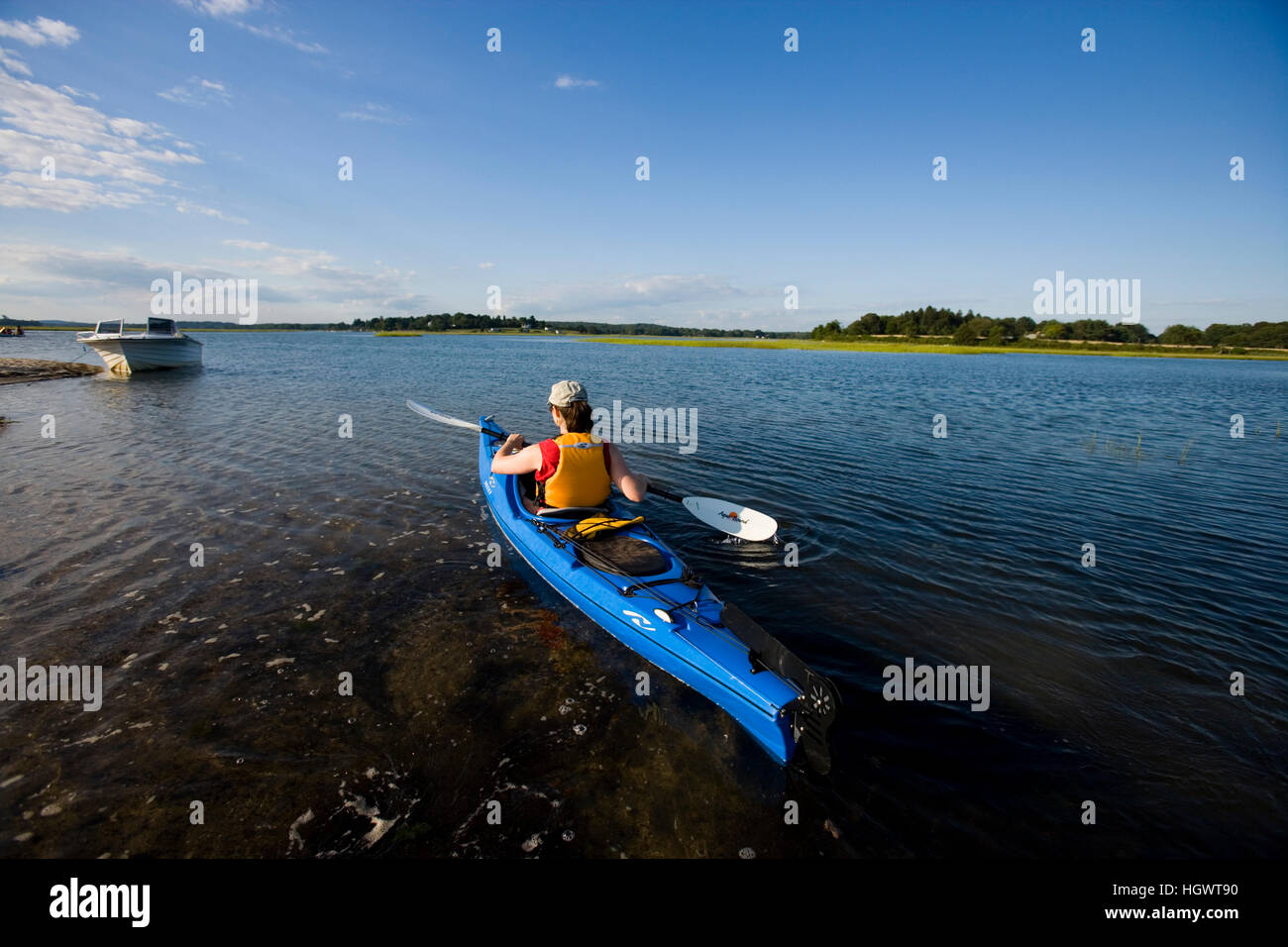 A woman kayaks near the mouth of the Connecticut River in Old Lyme