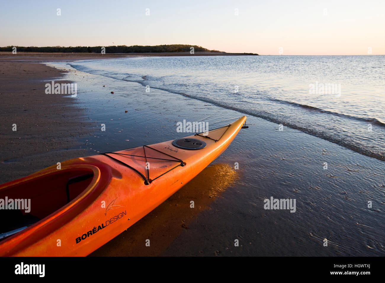 A kayak on the beach at dawn at the Shifting Lots Preserve in Plymouth