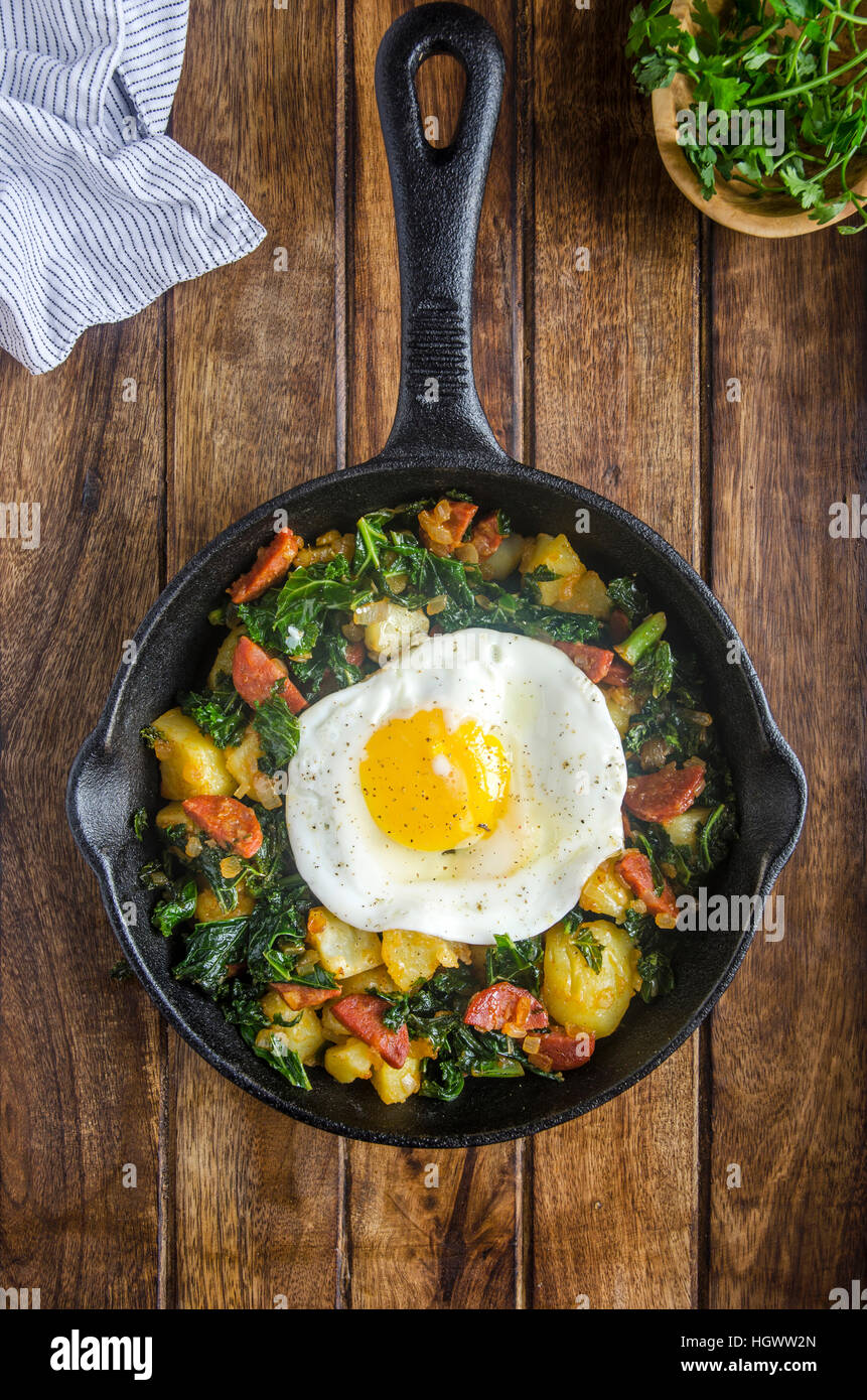 Chorizo and kale hash with a fried egg Stock Photo Alamy