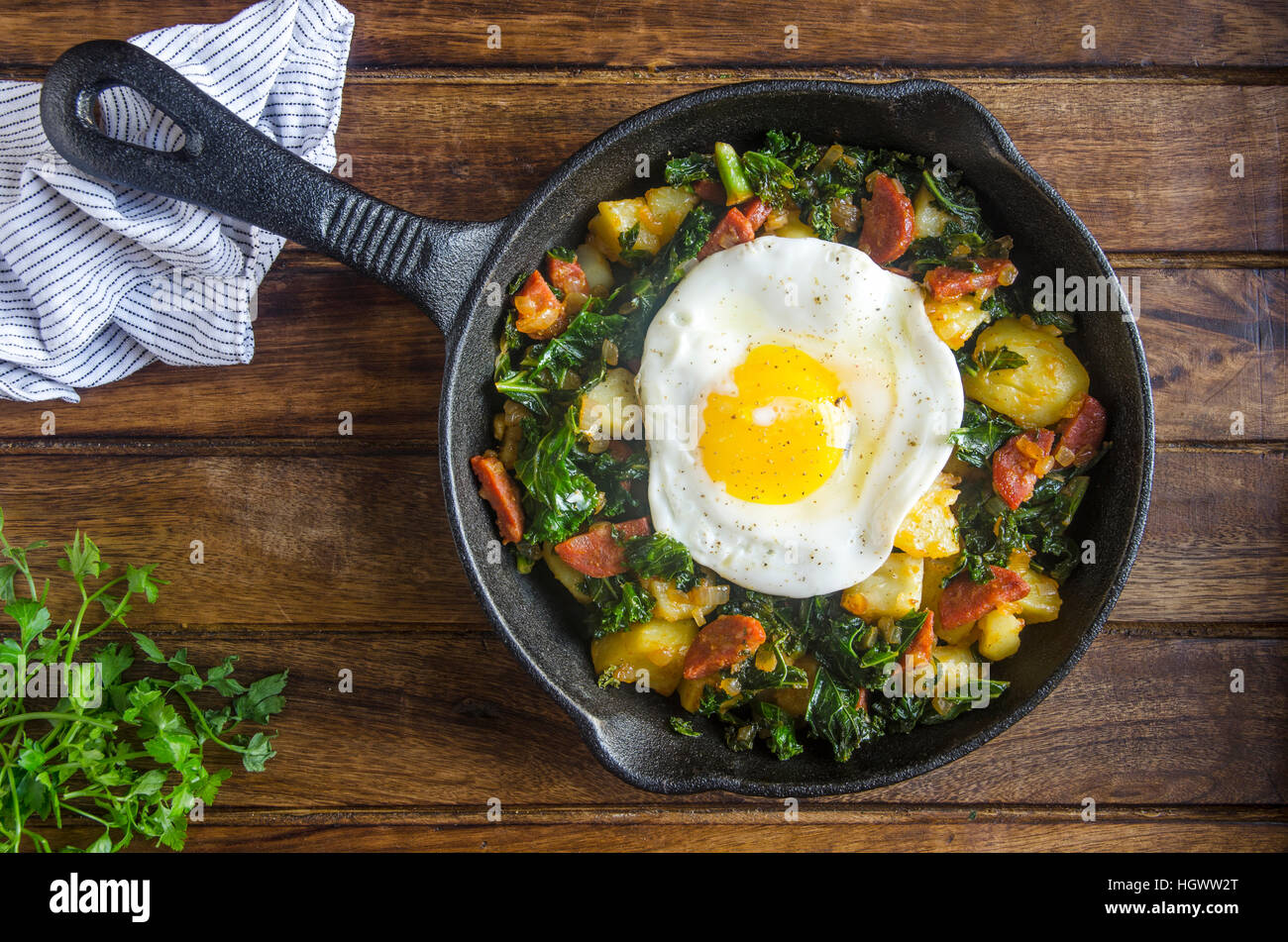 Chorizo and kale hash with a fried egg Stock Photo Alamy