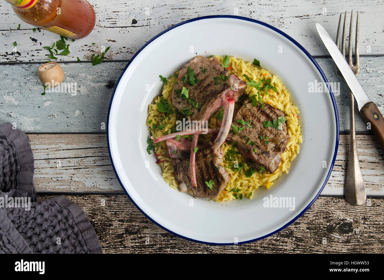 Griddled lamb chops with rice Stock Photo