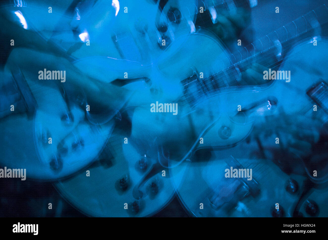 Guitar player in blue, multiple exposures Stock Photo