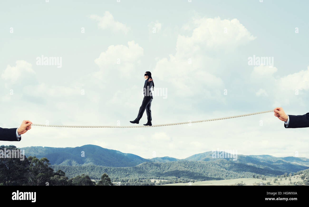 Business concept of risk support and assistance with man balancing on ...