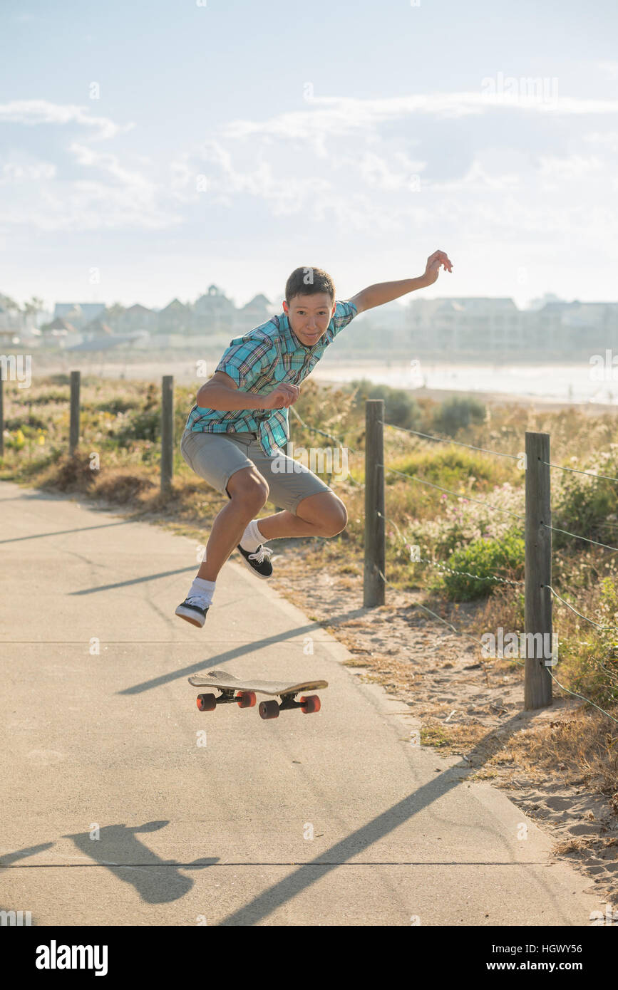 teenager have fun and high jumping with skateboard Stock Photo Alamy