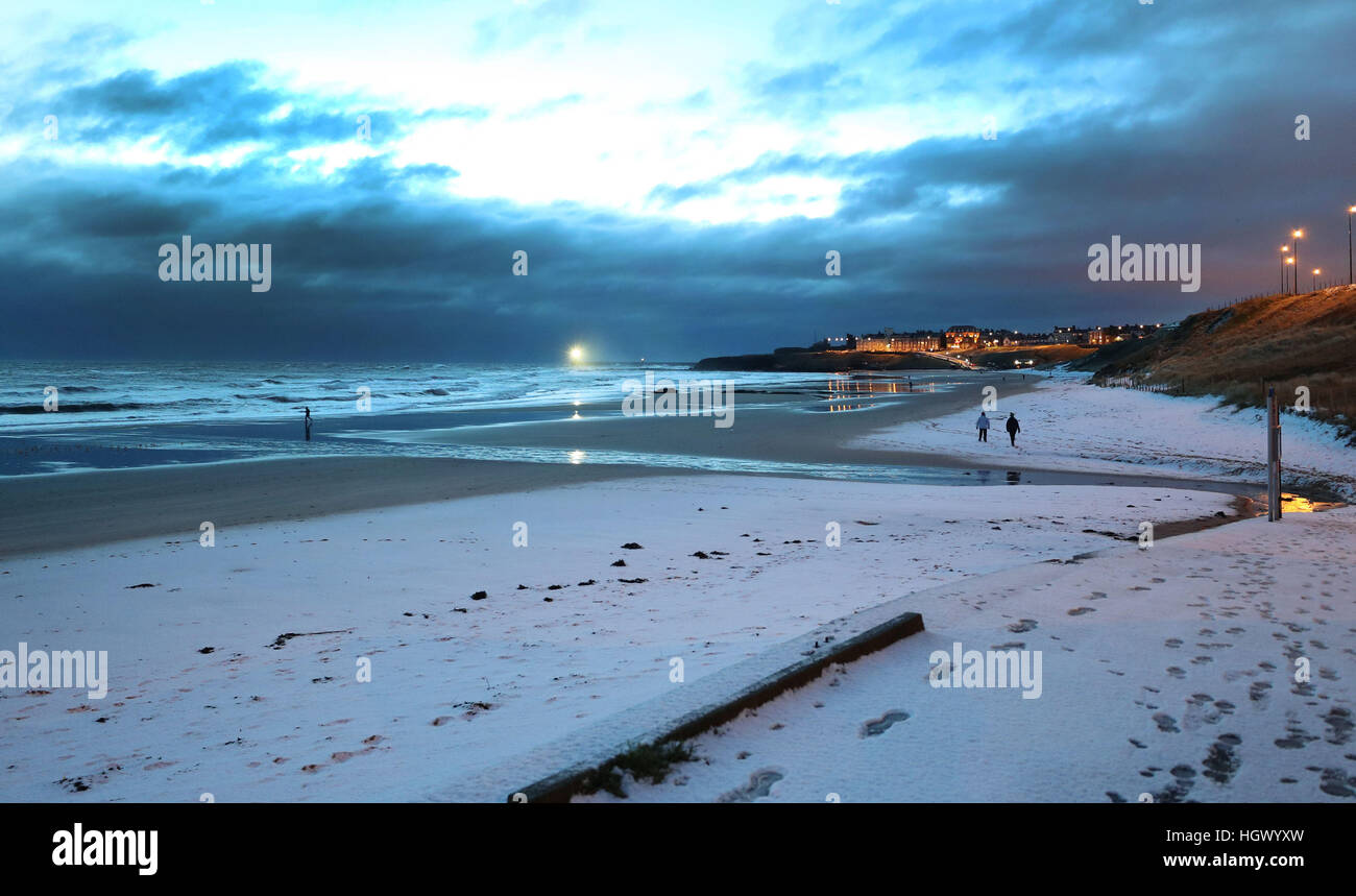 Overnight snow on Tynemouth Beach, North Tyneside, after some overnight snow, as Scotland and the North of England were covered in a blanket of snow while the east coast was braced for a storm surge at Friday lunchtime. Stock Photo