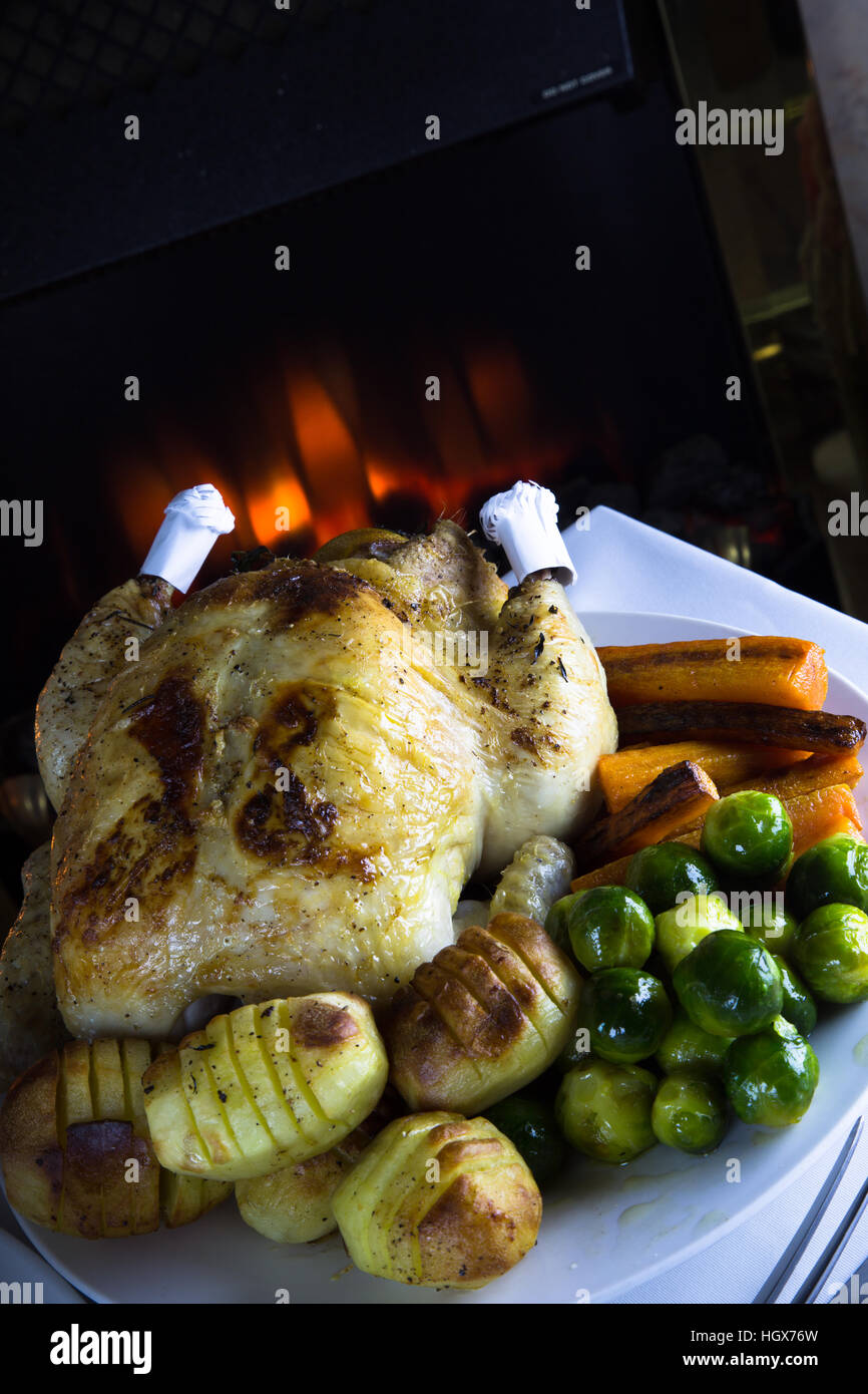 Whole Roast Chicken with potatoes and fresh cooked vegetables ready for