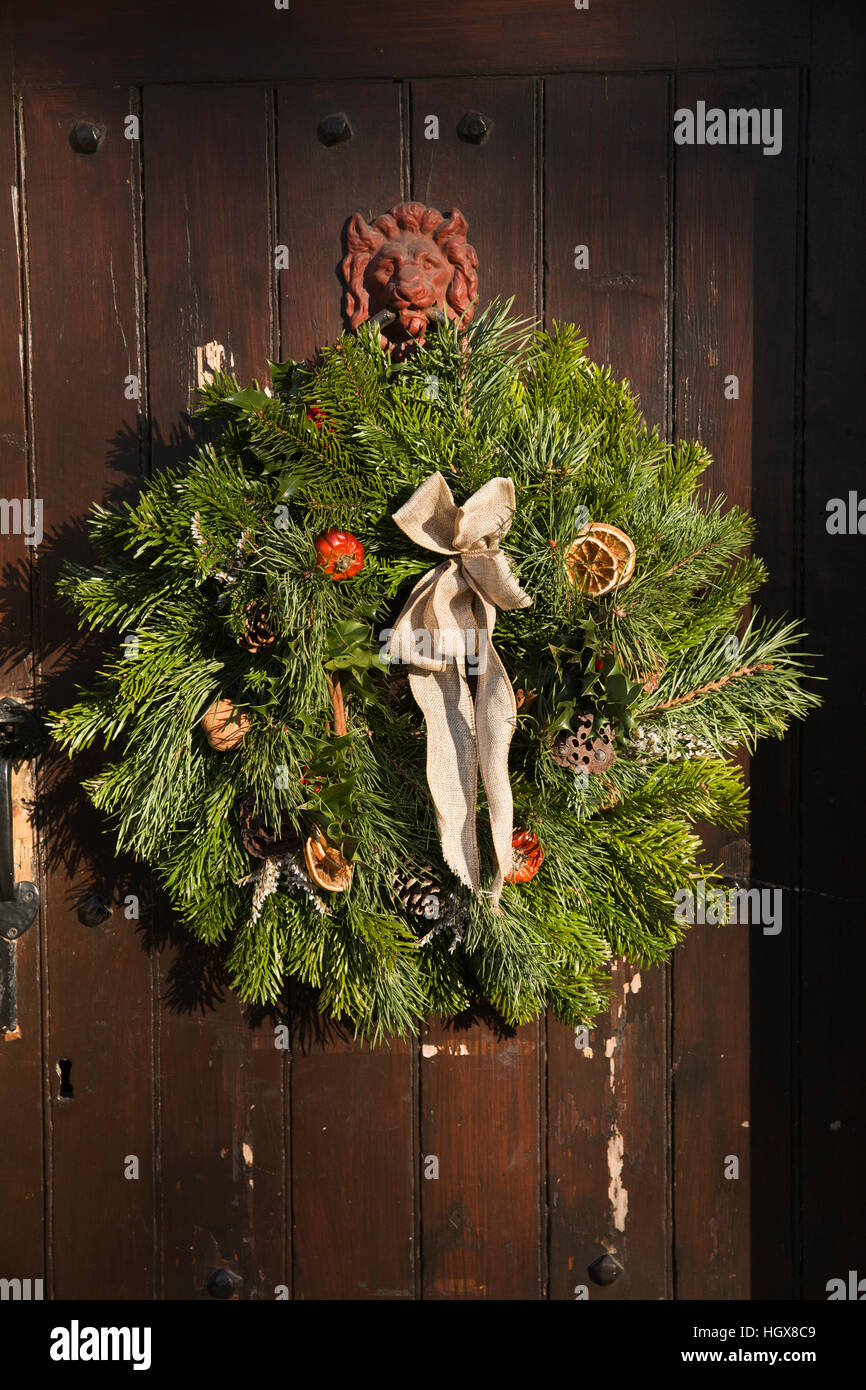 UK, England, Derbyshire, Litton, Red Lion Inn, Christmas wreath on door Stock Photo