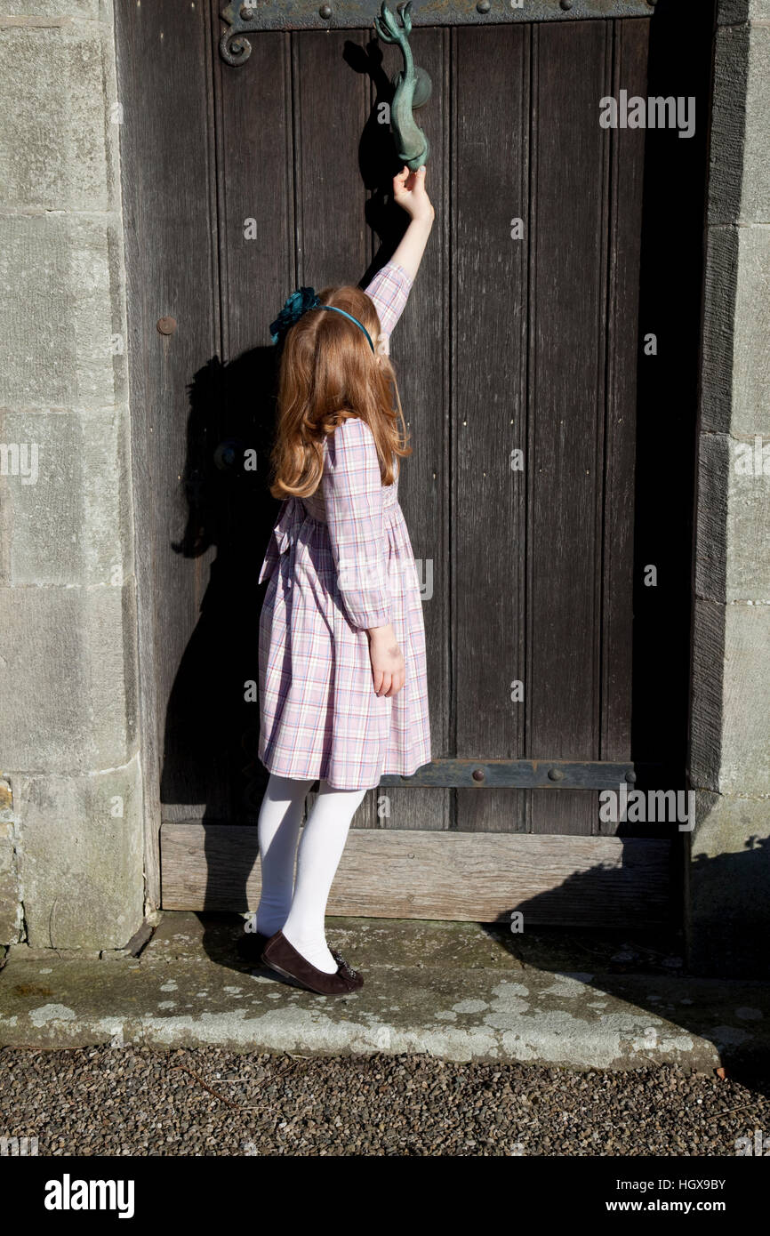 Young girl at door, Lancashire UK Stock Photo