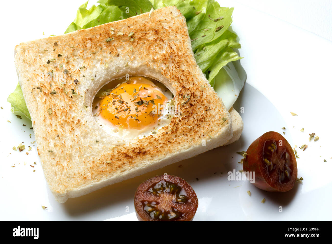 egg sandwich with lettuce and tomato in a beautiful food style Stock Photo