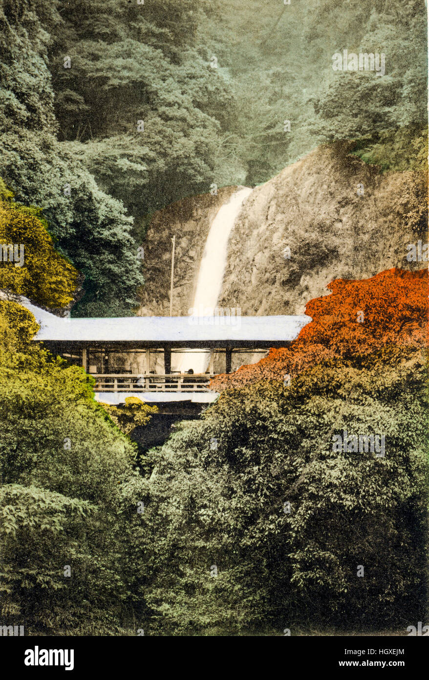 Japan, Kobe. Vintage postcard hand coloured. Landmark mountain Nunobiki waterfall with covered walkway. Circa 1910. Stock Photo