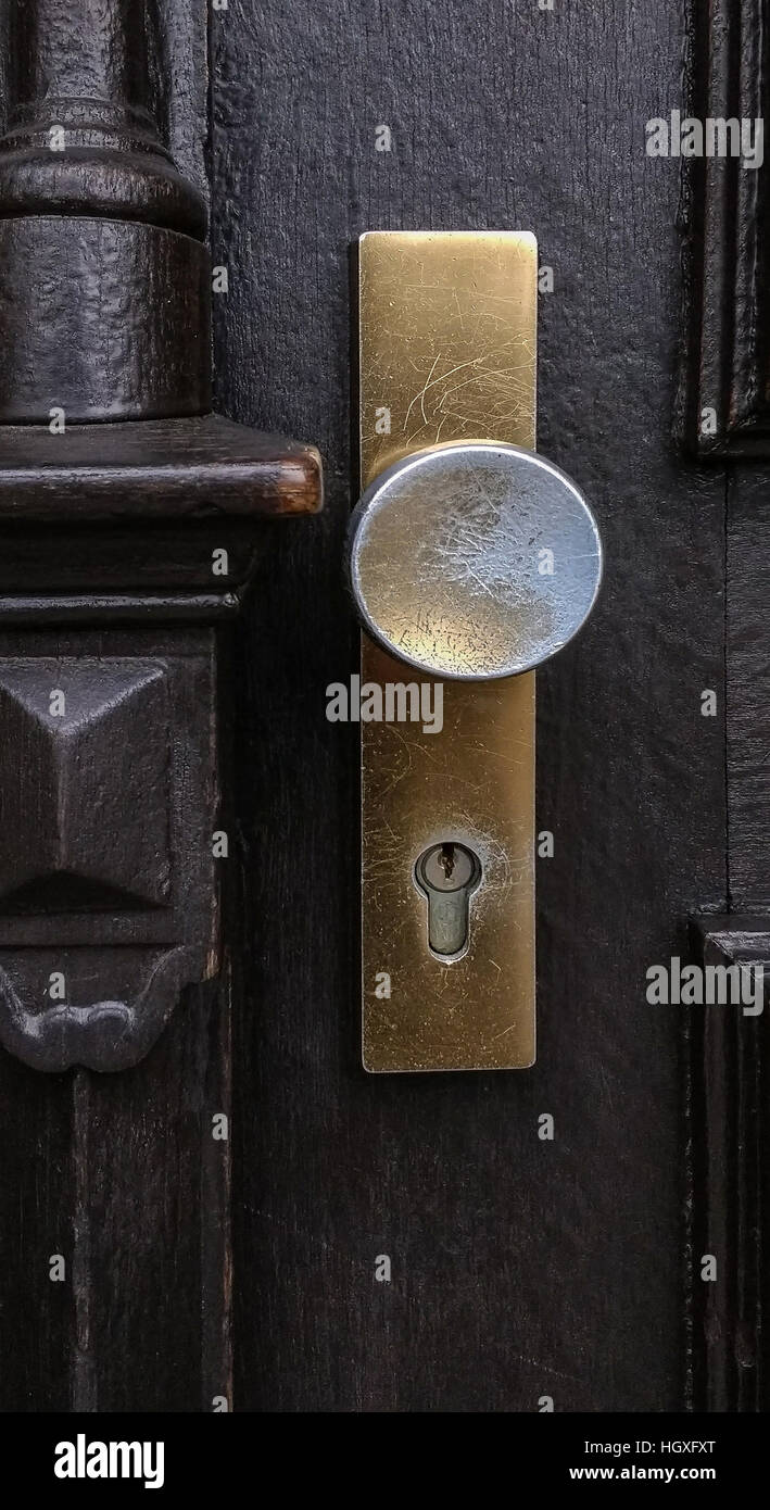 Golden scratched and heavy used doorknob Stock Photo