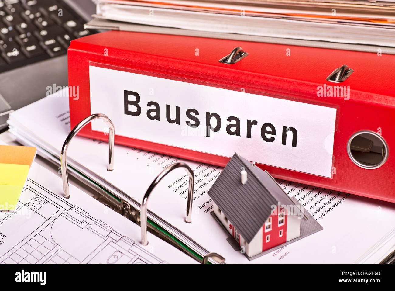 Red file folder labeled 'Bausparen' for building savings Stock Photo