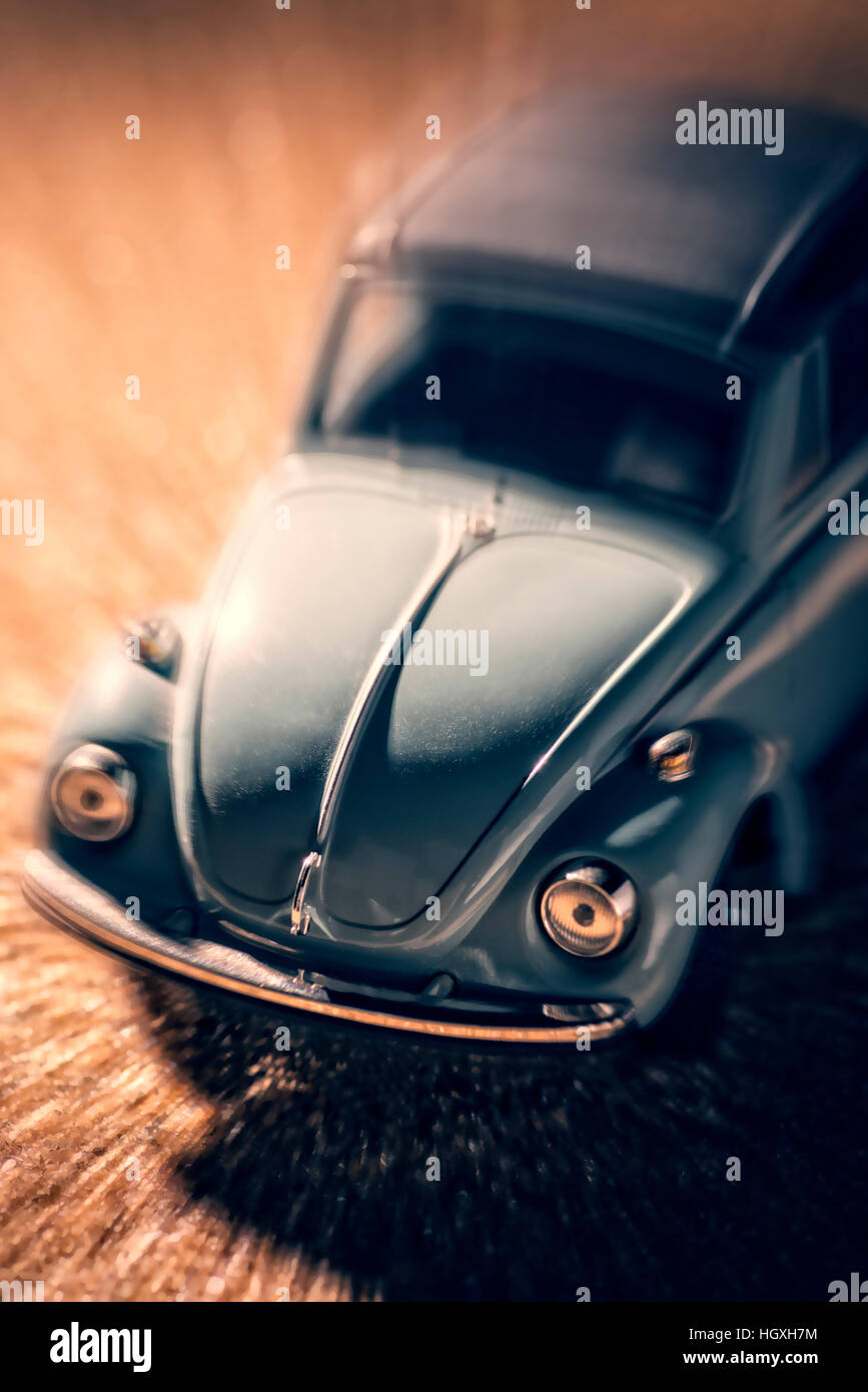 A VW Beetle convertible on sandy ground Stock Photo
