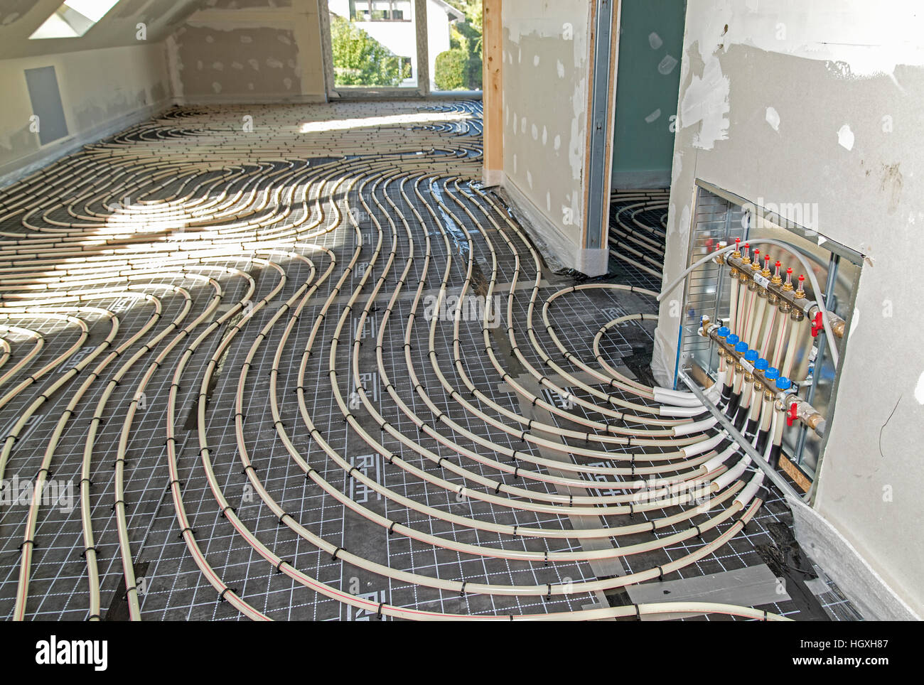 Pipes of an underfloor heating during installation Stock Photo